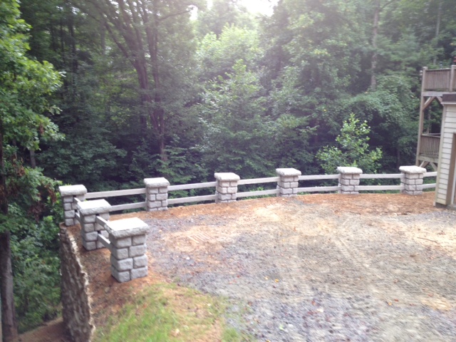 Jerry T. Whitmire Grading of Brevard, NC installed this precast concrete fence to compliment the Redirock retaing walls.