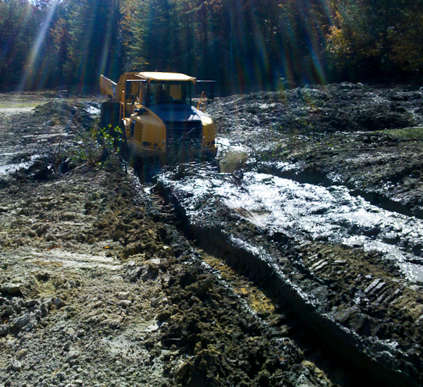 With all wheel drive, articulated trucks make lake and dam projects much easier.      